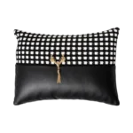 BLACK & WHITE GRID KNIT & FAUX LEATHER LUMBAR PILLOW WITH GOLD DEER PENDANT